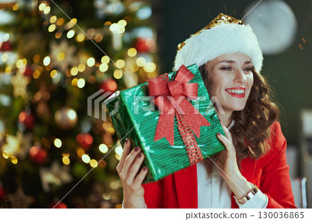 happy business woman in green office with Christmas tree happy business woman in green office with Christmas tree 130036865