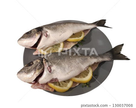 Two gilthead seabream prepared for cooking with lemon and rosemary Two gilthead seabream prepared for cooking with lemon and rosemary 130037008