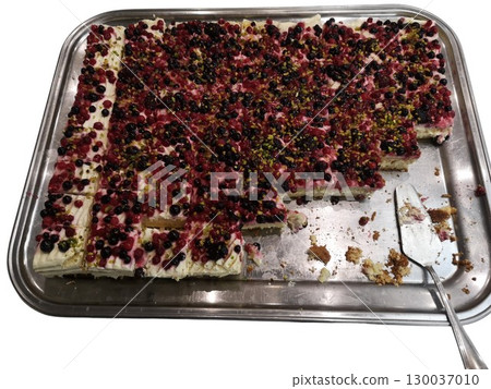 Delicious berry cake with pistachios on a serving tray Delicious berry cake with pistachios on a serving tray 130037010
