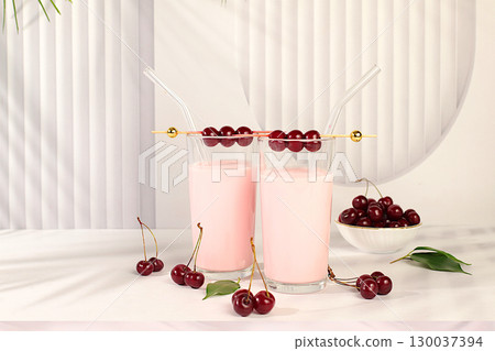 Cherry smoothie in glasses with fresh cream and fresh cherries on elegant table, detox diet and natural food concept, healthy breakfast with ingredients.healthy lifestyle advertisement, baby food. 130037394