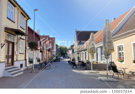 A picturesque, cobbled street in a charming European town in Parnu, Estonia on a sunny day 130037834