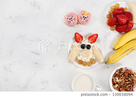 Granola, cottage cheese and fresh strawberries and grapes on a light table. The concept of healthy and natural nutrition, diet healthy dessert. Healthy breakfast, funny food for children, lifestyle, I Granola, cottage cheese and fresh strawberries and grapes on a light table. The concept of healthy and natural nutrition, diet healthy dessert. Healthy breakfast, funny food for children, lifestyle, I 130038094