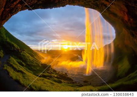 Beautiful sunset view from inside Seljalandsfoss waterfall in Iceland Beautiful sunset view from inside Seljalandsfoss waterfall in Iceland 130038643