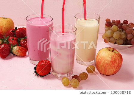 Strawberry and apple smoothie and granola, granola, fresh berries, apples, strawberries and grapes on a wooden sunny background. The concept of healthy and natural food. Healthy breakfast, food for Strawberry and apple smoothie and granola, granola, fresh berries, apples, strawberries and grapes on a wooden sunny background. The concept of healthy and natural food. Healthy breakfast, food for 130038718