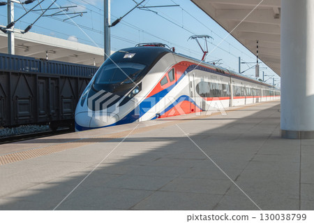 Vang Vieng, Laos  - December 30, 2022: Modern high-speed train at station platform ready for departure 130038799