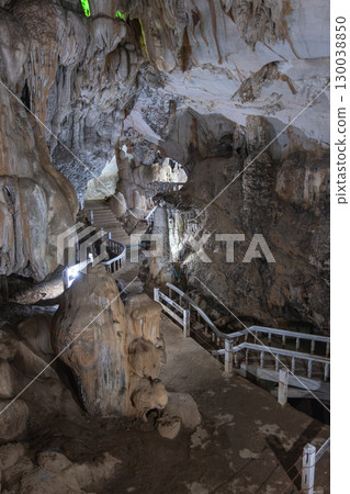 Jang Cave, Vang Vieng, Laos, Pathway inside limestone cave with stairs and railings for tourist exploration in Luang Prabang, Laos Jang Cave, Vang Vieng, Laos, Pathway inside limestone cave with stairs and railings for tourist exploration in Luang Prabang, Laos 130038850