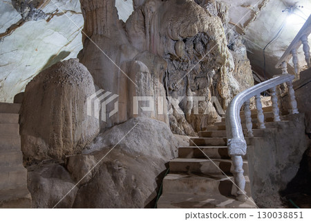 Jang Cave, Vang Vieng, Laos, Stone staircase inside natural cave with rock formations and railing  in Luang Prabang, Laos 130038851
