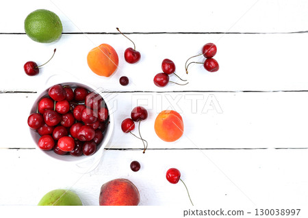 Healthy breakfast with ingredients, summer fruits and berries with grapes, cherries and peaches on a bright table. The concept of a healthy and natural diet, lifestyle, flat lay 130038997