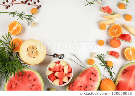 Fruit salad with watermelon and melon, Fresh tropical fruits and berries on a bright sunny table, natural and healthy food concept, ingredients for a healthy breakfast, detox diet and weight loss, 130039058