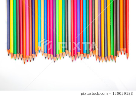 A row of vibrant colored pencils on a white background 130039188
