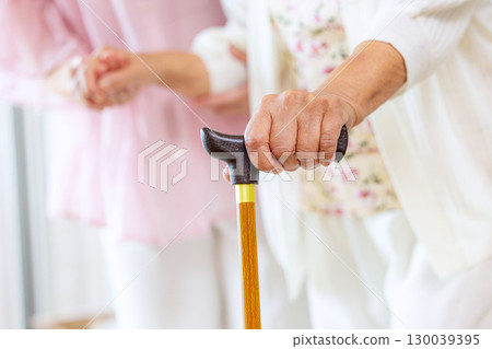Senior woman with cane Senior woman with cane 130039395