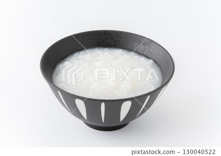 Porridge in a bowl on a white background 130040522