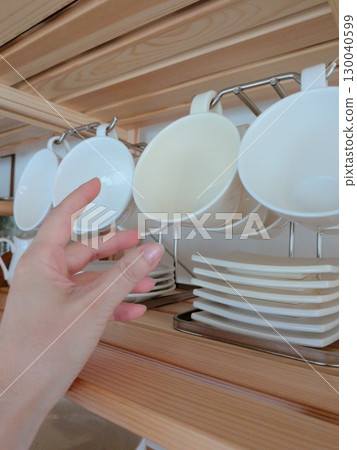 Where to store dishes in the cupboard 130040599