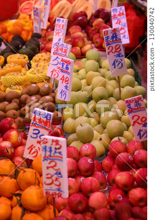 Fruits such as oranges sold at the open-air market. Most of them are imported. 130040742