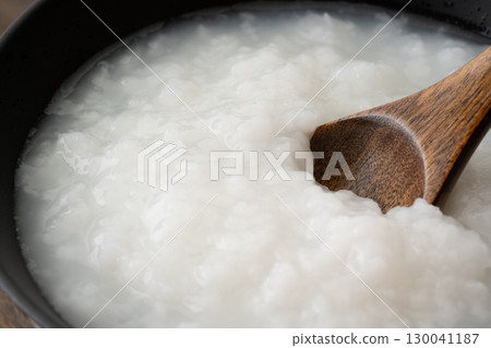Close-up of porridge being scooped with a spoon Close-up of porridge being scooped with a spoon 130041187