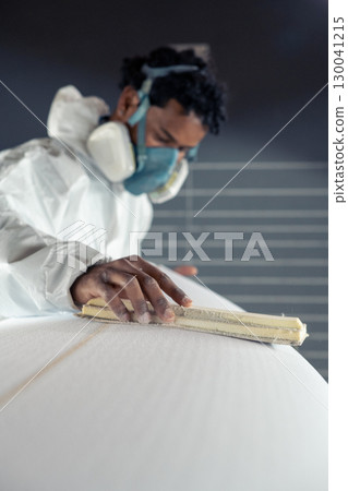 Shaper working on surf board Shaper working on surf board 130041215