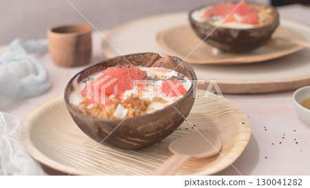 Yogurt with grapefruit, granola, chia and honey Yogurt with grapefruit, granola, chia and honey 130041282