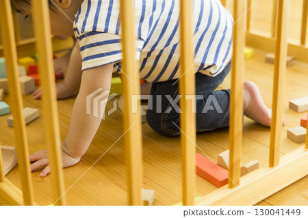 Infants playing indoors 130041449