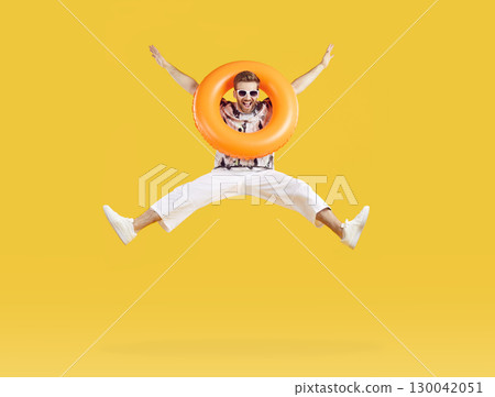 Happy, excited young man having fun at beach or pool party during summer holiday Happy, excited young man having fun at beach or pool party during summer holiday 130042051