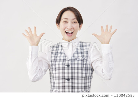 Female office worker surprised with a smile on white background Female office worker surprised with a smile on white background 130042583