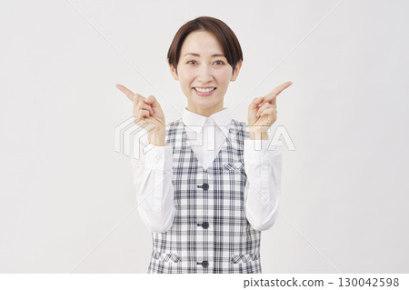 Female office worker pointing left and right on white background Female office worker pointing left and right on white background 130042598