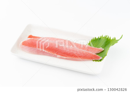 A boiled alfonsino on a square plate on a white background 130042826