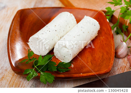 Goat milk cheese with herbs and garlic Goat milk cheese with herbs and garlic 130045428