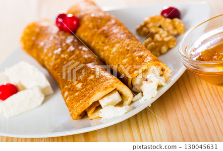 Pancakes with young cheese Pancakes with young cheese 130045631