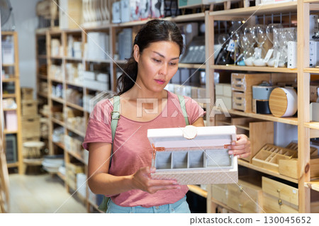 Asian woman buying wooden jewelry boxes at hardware supermarket 130045652