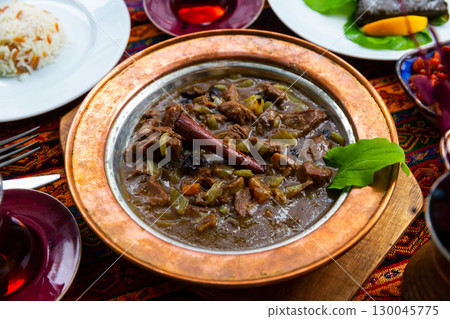 Turkish stewed lamb with onions and dried fruits Mutancana 130045775