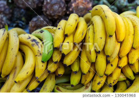 Showcase with ripe yellow bananas in greengrocery 130045968