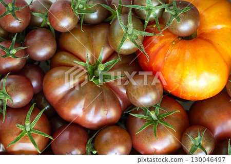 Vibrant Display of Fresh Heirloom and Cherry Tomatoes in Close-Up Vibrant Display of Fresh Heirloom and Cherry Tomatoes in Close-Up 130046497