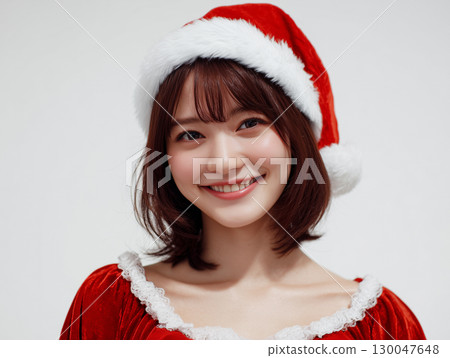Smiling portrait of a Japanese woman wearing a Santa hat (advertising, social media, event) Smiling portrait of a Japanese woman wearing a Santa hat (advertising, social media, event) 130047648