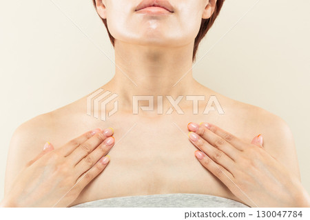 Close-up of a young Asian woman's chest to neck. Close-up of a young Asian woman's chest to neck. 130047784
