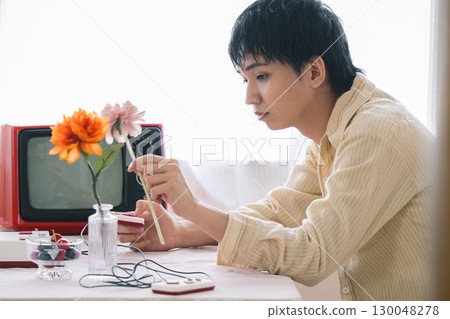 Young people spending time in a room with a nostalgic atmosphere 130048278