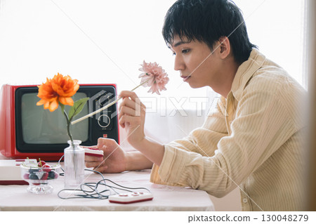 Young people spending time in a room with a nostalgic atmosphere 130048279