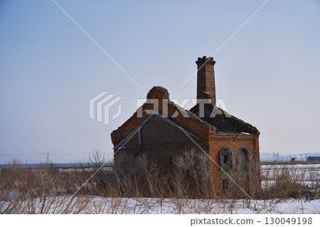 Early spring in Wakkanai, Hokkaido: The former Akita Lumber Factory Power Plant, made of brick, surrounded by remaining snow 130049198