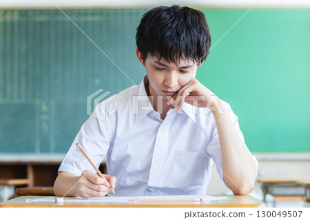 Male high school student studying 130049507