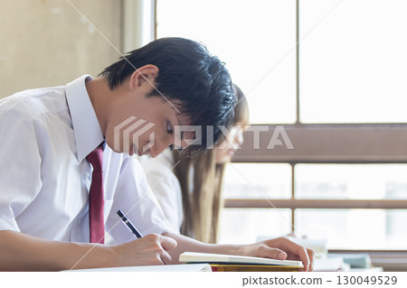 Male high school student studying Male high school student studying 130049529