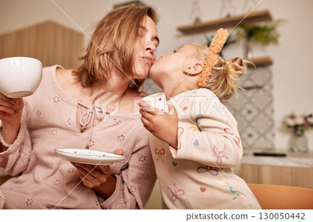 Mother and daughter sharing a loving moment together at home Mother and daughter sharing a loving moment together at home 130050442