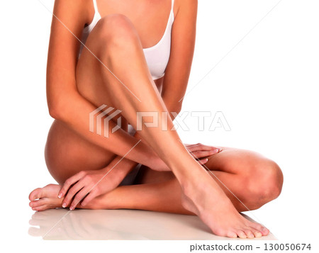 Young woman with slim body, isolated on white background 130050674