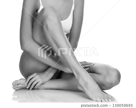 Young woman with slim body, isolated on white background Young woman with slim body, isolated on white background 130050693