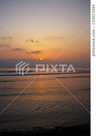 Cape Soya in early spring: The sun rises over the northernmost point of Japan in the morning glow of spring haze Cape Soya in early spring: The sun rises over the northernmost point of Japan in the morning glow of spring haze 130053094