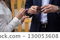 Young couple at the wedding exchanges engagement rings 130053608