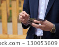 Young couple at the wedding exchanges engagement rings 130053609