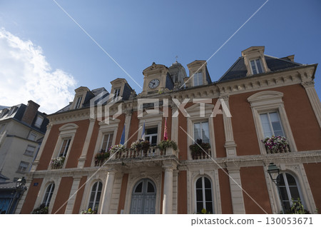 Cauteret's town hall building showcases stunning architecture under a clear blue sky with charming 130053671