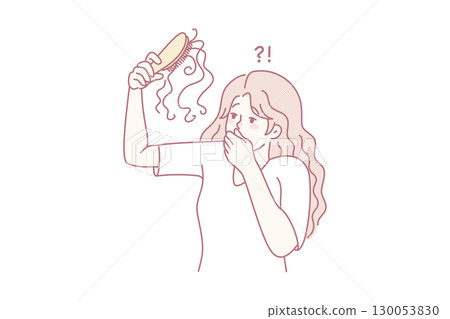 Unhappy woman frustrated with hair loss 130053830