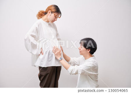 Couple facing each other, pregnant woman, maternity Couple facing each other, pregnant woman, maternity 130054065
