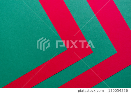 Overlapping green and red construction paper 130054256