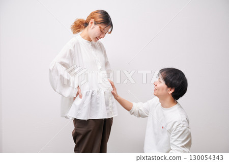 Couple facing each other, pregnant woman, maternity Couple facing each other, pregnant woman, maternity 130054343